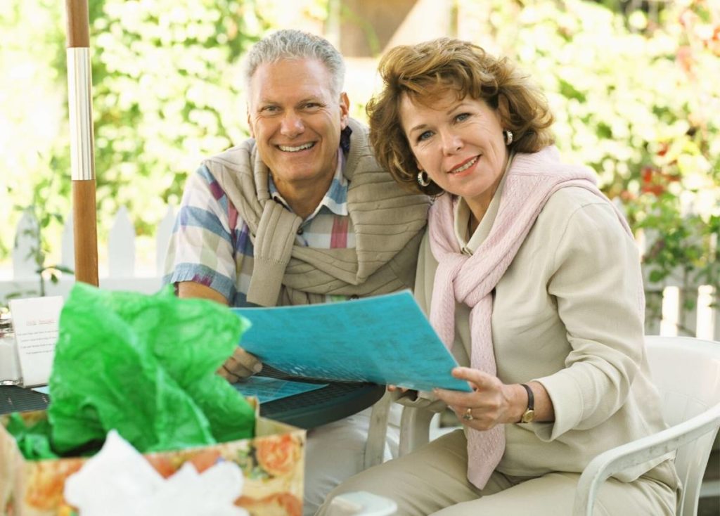 A couple at home using a Reverse Mortgage