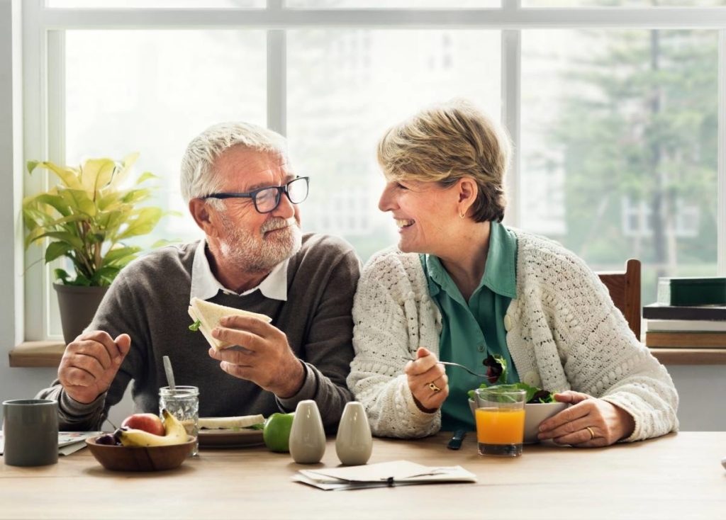 Two seniors discussing the average retirement income