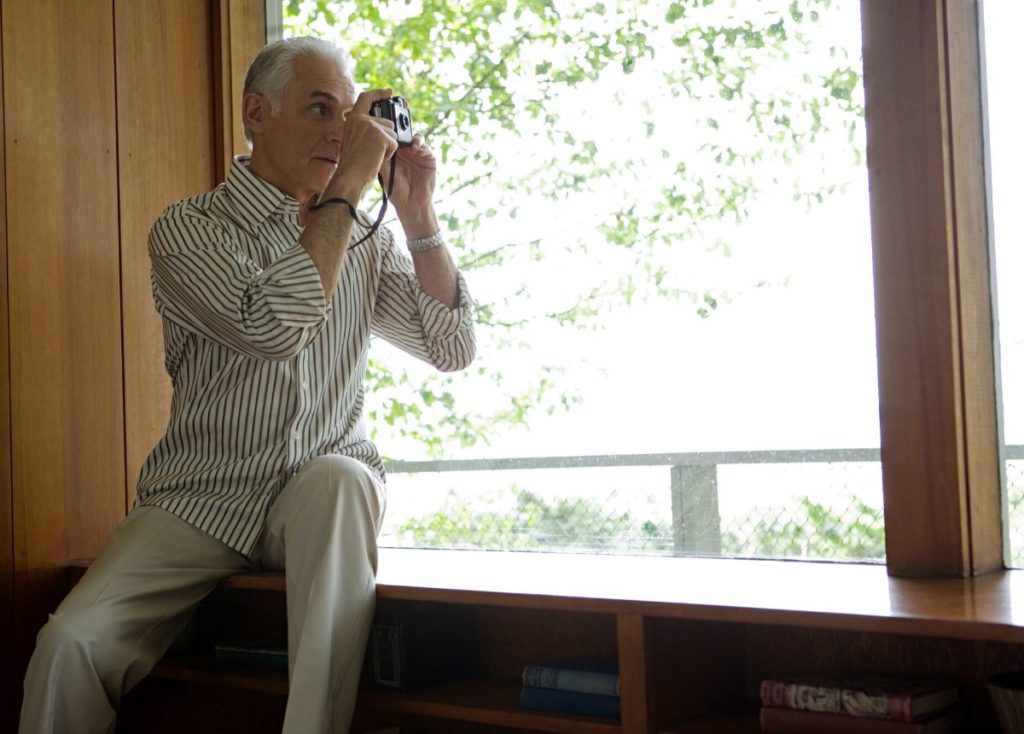 retiree taking photos at home