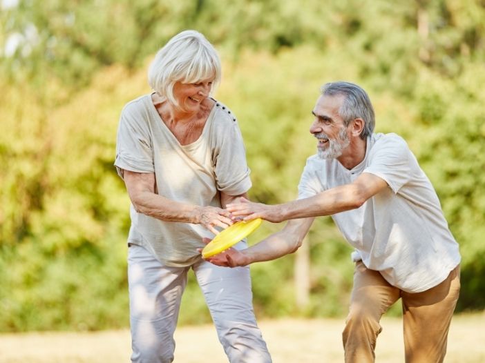 senior citizens playing outdoors